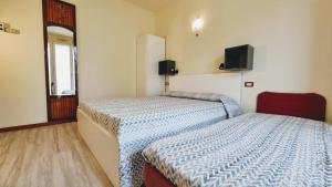 Postel nebo postele na pokoji v ubytování Residence Rosa