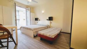 Postel nebo postele na pokoji v ubytování Residence Rosa