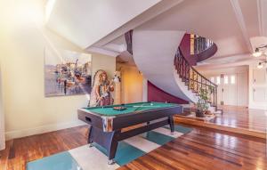 a room with a pool table and a spiral staircase at Exclusive VILLA Volme in Banjole