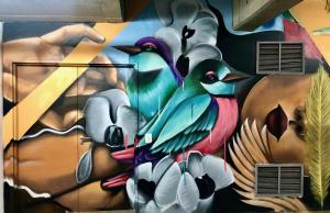 a painting of birds on the side of a wall at Menlyn Boutique Hotel in Pretoria