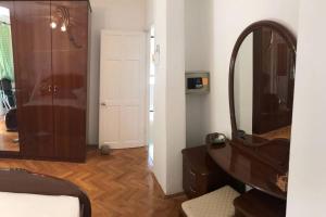 a bathroom with a vanity and a mirror and a sink at Whole villa in Primošten in Primošten