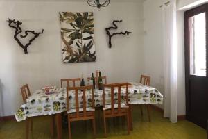a dining room table with chairs and a tablecloth on it at Whole villa in Primošten in Primošten