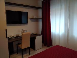 TV a/nebo společenská místnost v ubytování Hotel Cajeta