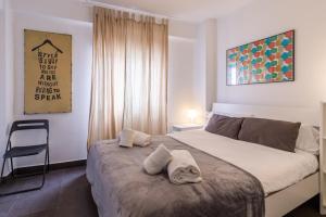 Posteľ alebo postele v izbe v ubytovaní FUN BUILDING PENTHOUSES by HOMEABOUT