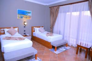 Postel nebo postele na pokoji v ubytování Haile Resort Adama