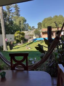 a hammock on a patio with a yard at La casa deMarta in Cordoba