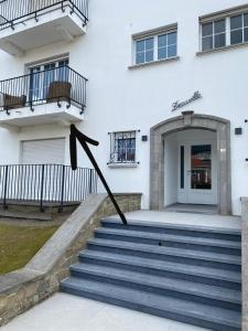 a building with stairs in front of a building at Mar y sal in Knokke-Heist
