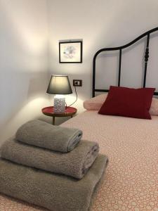 Postel nebo postele na pokoji v ubytování L'Antica Dimora
