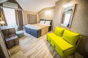 Postel nebo postele na pokoji v ubytování Vida Family Hotel
