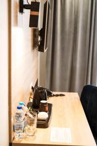 Telewizja i/lub zestaw kina domowego w obiekcie Gold Hotel