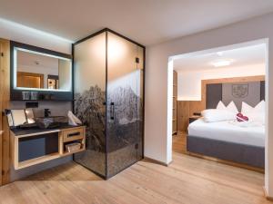 Uma cama ou camas num quarto em Dorfkaiser Appartements
