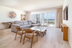 a living room with a couch and a table at Zahara Beach & Spa by QHotels - Adults Recommended in Zahara de los Atunes