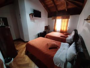 Letto o letti in una camera di Hosteria San Jose de Sigchos
