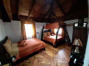Letto o letti in una camera di Hosteria San Jose de Sigchos