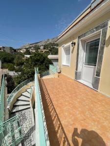 a view of a balcony of a house at Odysseus in Vrontados