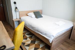 Łóżko lub łóżka w pokoju w obiekcie Gold Hotel