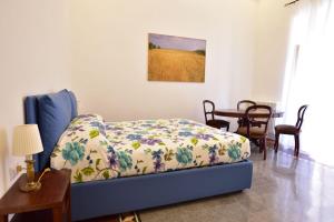 Postel nebo postele na pokoji v ubytování All'Angolo B&B