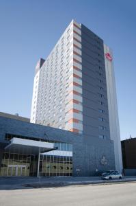 a large building with a car parked in front of it at Canad Inns Health Sciences Centre in Winnipeg