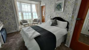 Postel nebo postele na pokoji v ubytování Lichfield House
