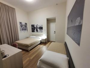 Posteľ alebo postele v izbe v ubytovaní Toledo Place