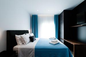 Postel nebo postele na pokoji v ubytování Athena Center Apartments