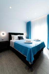 Postel nebo postele na pokoji v ubytování Athena Center Apartments