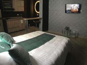 TV o dispositivi per l'intrattenimento presso Apartahotel Avanti