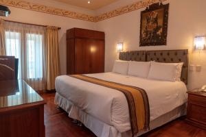 Postel nebo postele na pokoji v ubytování Hotel Rojas Inn