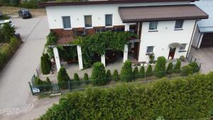 an aerial view of a house with a fence at Rooms for Rent near Vilnius in Bezdonys