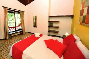 
Een bed of bedden in een kamer bij Brasil Tropical Village
