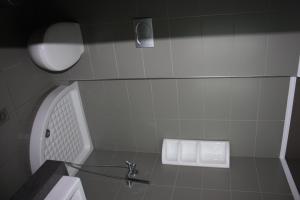 Kúpeľňa v ubytovaní Hotel Cariatis