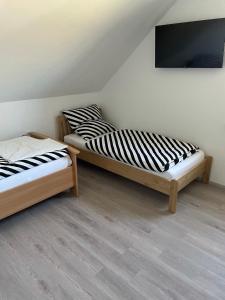 Postel nebo postele na pokoji v ubytování Jahn Apartments