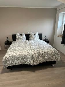 Postel nebo postele na pokoji v ubytování Jahn Apartments