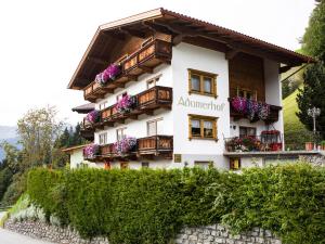 a building with flower boxes and balconies on it at "Adamerhof" in Gerlosberg