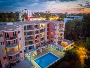 an overhead view of a building with a swimming pool at apartament PIANO in Mamaia