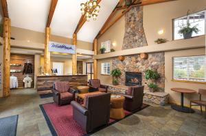 a lobby of a hotel with a stone fireplace at WorldMark Estes Park in Estes Park