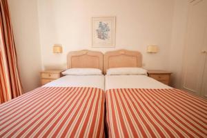 Posteľ alebo postele v izbe v ubytovaní Bungalow Villa Verde 2