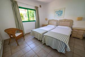 Posteľ alebo postele v izbe v ubytovaní Bungalow Villa Verde 2