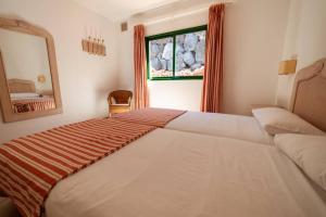 Posteľ alebo postele v izbe v ubytovaní Bungalow Villa Verde 2