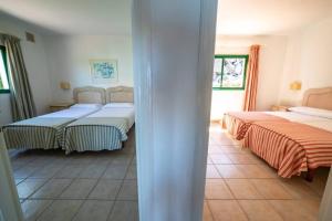 Posteľ alebo postele v izbe v ubytovaní Bungalow Villa Verde 2