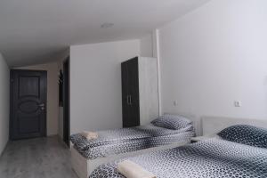Postel nebo postele na pokoji v ubytování Complex Praga