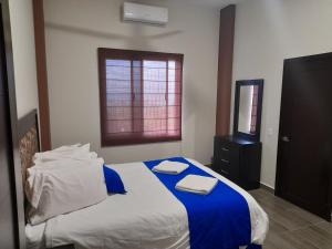 Voodi või voodid majutusasutuse Grand View Suites toas
