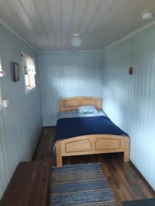 Postel nebo postele na pokoji v ubytování Lomamökki Mäntylä