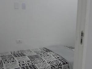 Кровать или кровати в номере Hostel com quartos individuais