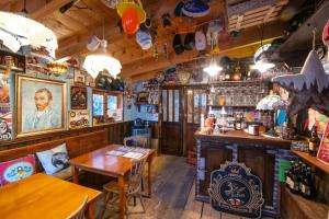a bar with a table and a counter in a room at Le Bassin du Tertre in Fronsac