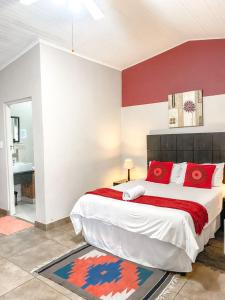 Ένα ή περισσότερα κρεβάτια σε δωμάτιο στο Mzanzi Rock Guesthouse