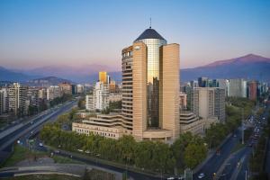 a tall building with a dome on top of a city at Mandarin Oriental, Santiago in Santiago