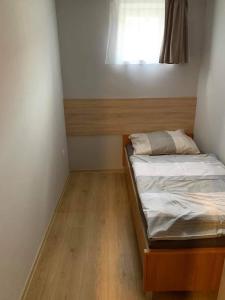 Postel nebo postele na pokoji v ubytování Beregi Apartman