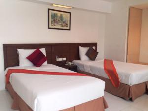 Voodi või voodid majutusasutuse Evergreen Resort toas