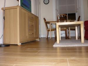 a dining room with a table and a table and chairs at Apartment Newington Area in Edinburgh